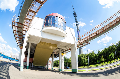 Moscow, Russia - July 8, 2019: Modern public urban transport. Moscow monorail line next the Ostankino tv tower in summer sunny day