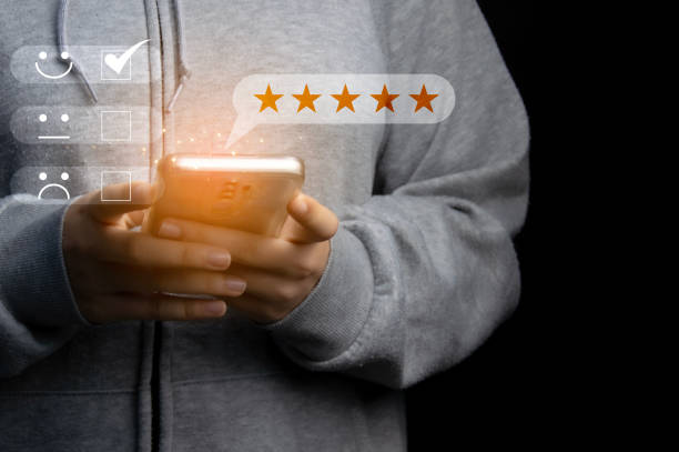 istock User give rating to service experience on online application, Customer review satisfaction feedback survey concept, Customer can evaluate quality of service leading to reputation ranking of business 2117419132