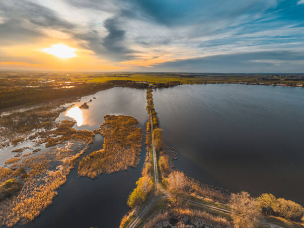 istock sunset over the ponds aerial view 2117440088
