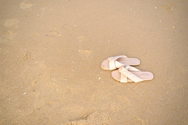 Female legs on beach. top view