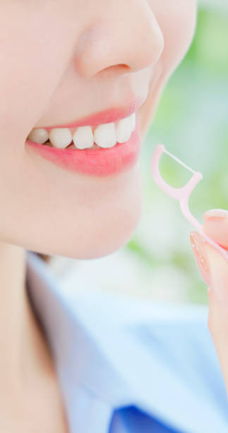 istock asian woman toothpick happy 2117467484