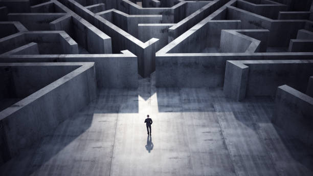 istock Businessman heading towards triangle shaped maze, Success Concept 2117492085