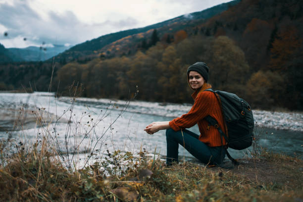 istock blue sky mountains woman landscape tourism backpack on back vacation relax 2117531802
