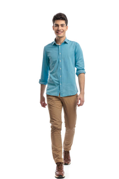 istock joyful casual man wearing blue shirt stepping forward 2117538387