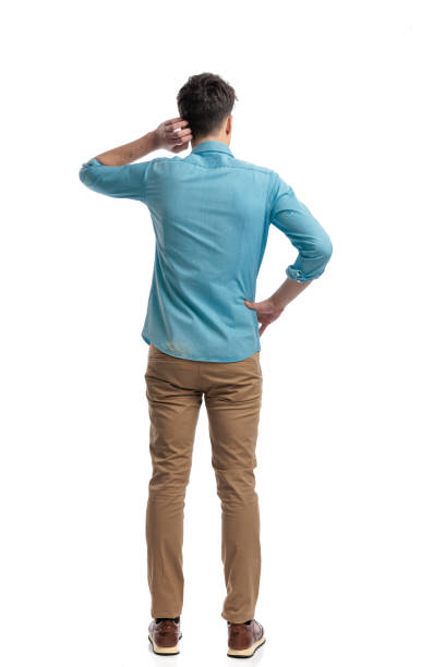 istock back view of puzzled casual man scratching his head 2117539440