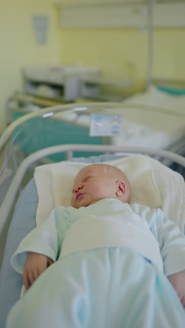 MS Tiny Yawns: Newborn Baby Boy Finds Peace in Hospital Crib at Maternity Ward