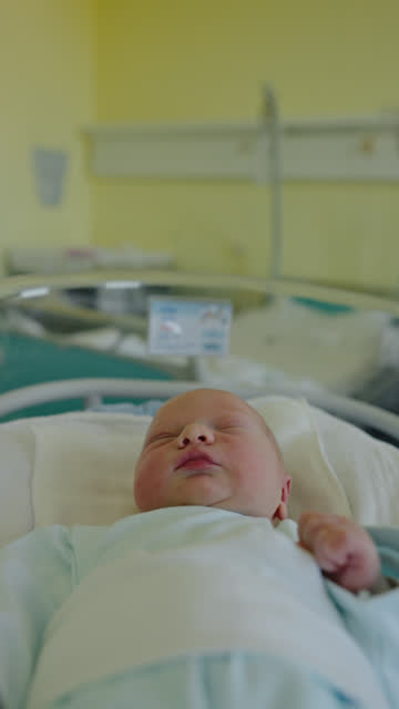 MS Newborn Innocence: Tiny Hands and Head Rest in Hospital Crib at Maternity Ward