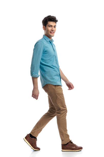 istock side view of casual man walking 2117551383