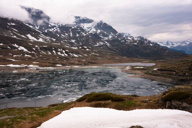 istock Mountain lake with ice in Switzerland in spring 2117553592