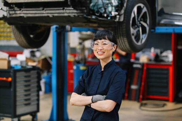 istock Female mechanic doing annual car inspection 2117554132