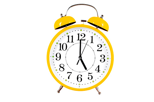 Yellow alarm clock isolated on the white background. High quality photo