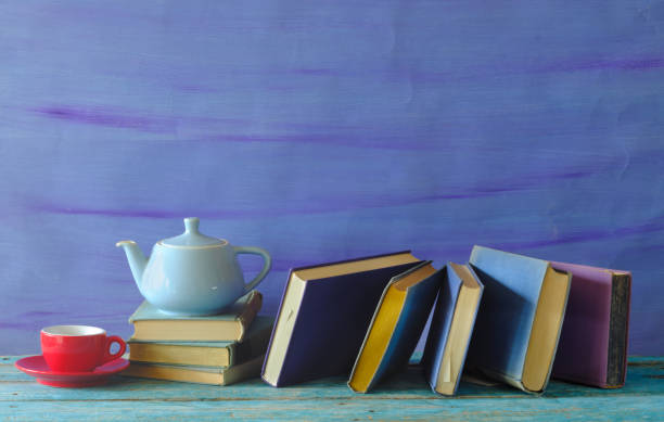 istock row of books with open book and cup of espresso coffee, reading, learning, knowledge is power,education or home office concept 2117576264