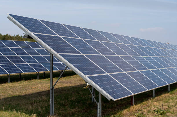 istock Solar panels in a solar power station 2117611773
