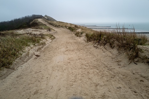 wide path high above the dunes on the north sea Zeeland Netherlands