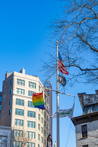 Christopher Park, Greenwich Village, Manhattan, New York, USA - March, 2024.  Flagpole at Christopher Park, which has played an important role in the history of the LGBT rights movement. The Stonewall uprising and other LGBT-related revolve around this Inn.