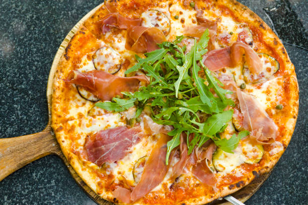 istock Fresh bacon pizza with lettuce and fig fruit 2117648046