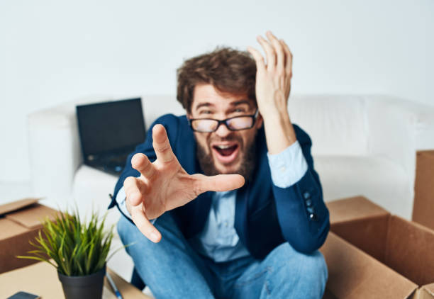 istock Business man emotion boxes with office official things 2117652866