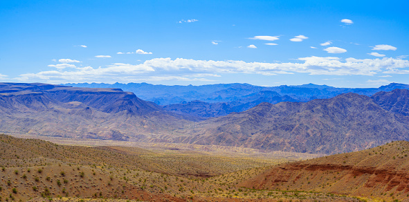 A view from Lake Mead Scenic View rest area along US-93 towards Willow Beach Marina with mountains in the background