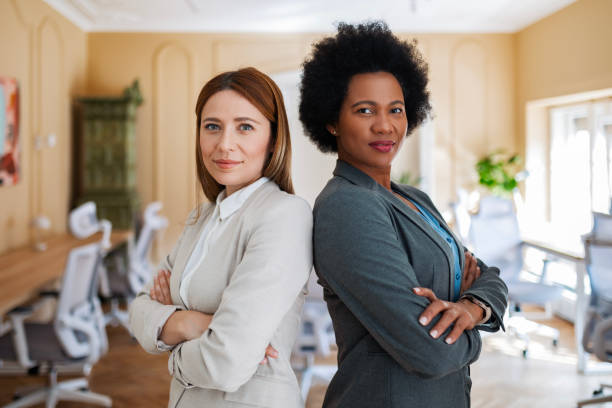istock Businesswoman Working Together In Office Posing 2117682794