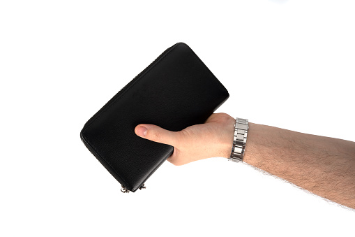 Man holding his leather wallet in a hands isolated on white background. High quality photo