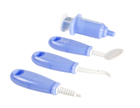 A set of blue and white dental tools, color combination gives a sense of cleanliness and sterility.
