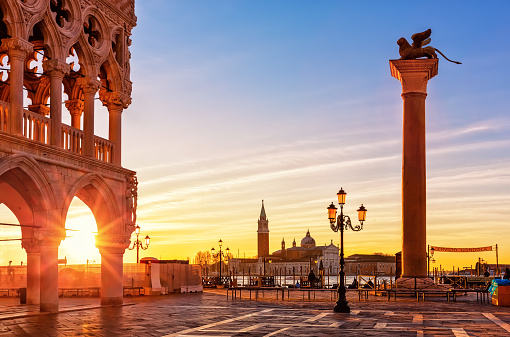Beautiful sunrise view of Doge's Palace (Palazzo Ducale), Lion of Saint Mark and piazza San Marco in Venice, Italy. Architecture and landmark of Venice. Sunrise cityscape of Venice.
