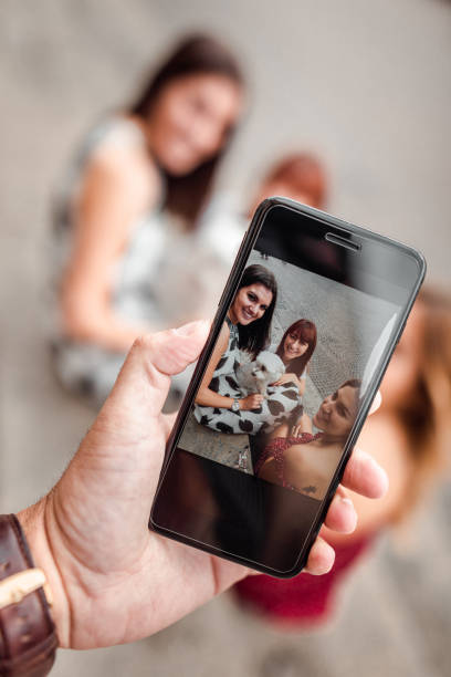 istock happiness friends with dog taking a pic 2117723661