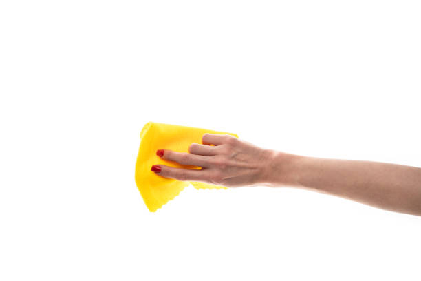istock Rag microfiber in female hand with red nails, isolated on a white background 2117739951