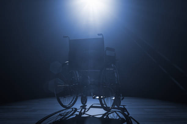 istock Back of Empty Wheelchair in Spotlight Lights. 3d Rendering 2117740534