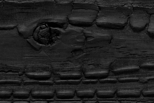 istock Overhead view of black wooden table 2117741071