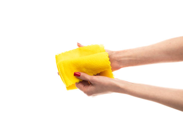 istock Rag microfiber in female hand with red nails, isolated on a white background 2117744383