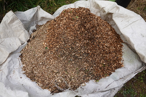bag with wood chip mulching to be placed on the fertilized soil of the vegetable garden