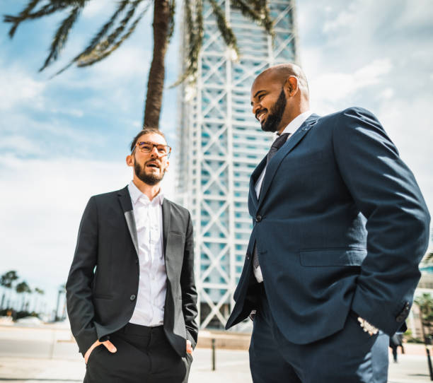 istock business man talking together in the park 2117754373