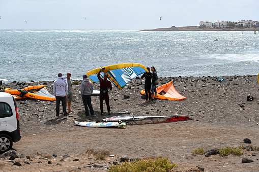 Puerto del Rosario, Fuerteventura, Spain, February 24, 2024 - Kitesurfers and windsurfers at Barlovento beach in Jandía, Fuerteventura, Canary Islands.
