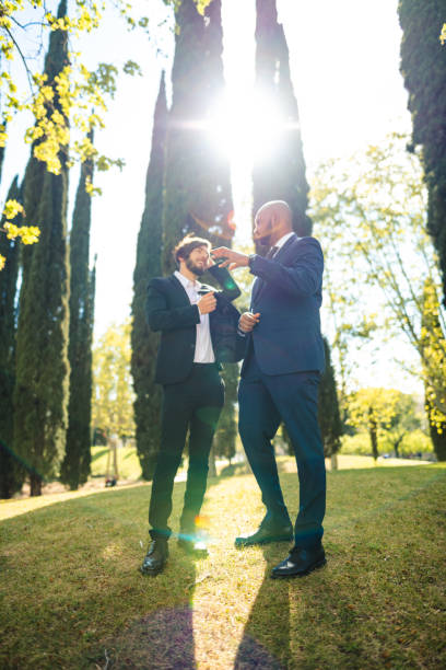 istock business man talking together in the park 2117755444