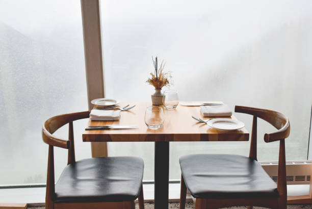 A typical Lyonnais bistro dining room with rustic wooden tables and traditional seating