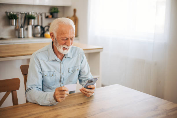 istock Senior purchasing some itens on the internet 2117786954