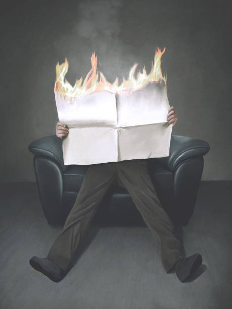 istock Illustration of man reading a burning newspaper, surreal bad news concept 2117787628