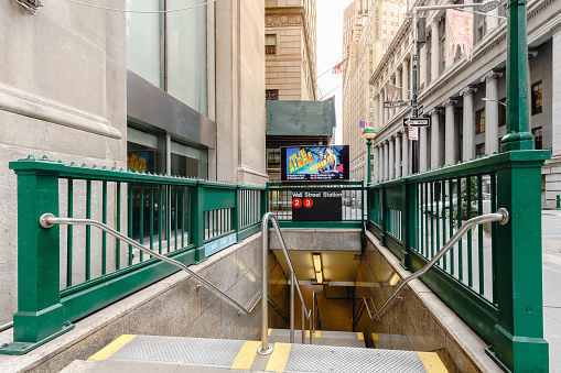 Wall Street, Manhattan, New York, USA - February 12, 2023: Wall Street Station subway entrance in the business district on a winter day