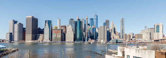 Brooklyn, New York, USA - February 11, 2023: View of Manhattan business district from Brooklyn on a winter day