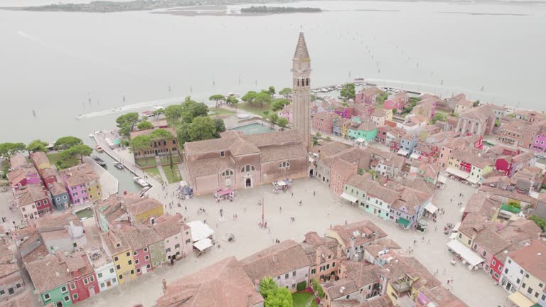 Church of Saint Martin Bishop And Colorful Houses In Burano Island, Venice, Italy. - aerial shot