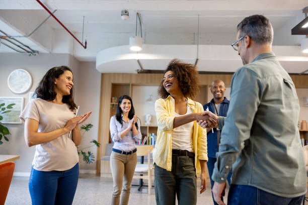 istock Welcoming a new hire at the office with a business handshake 2117819262