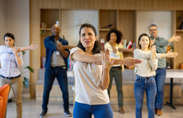 istock Business people taking a break and stretching at the office 2117819780
