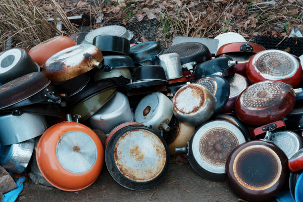 istock pile of discarded frying pans 2117858330