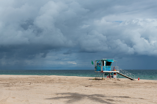 Life guard station Sandy beach with cloudy skies Miami Beach Florida
