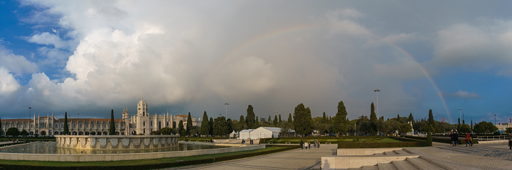 Panorama of the Hieronymites Monastery Mosteiro dos Jeronimos in Belem with rainbow on the sky above, Lisbon, Portugal