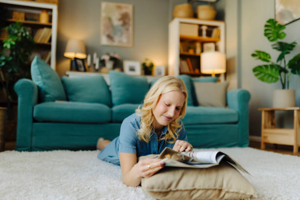 istock Woman reading a magazine 2117893668