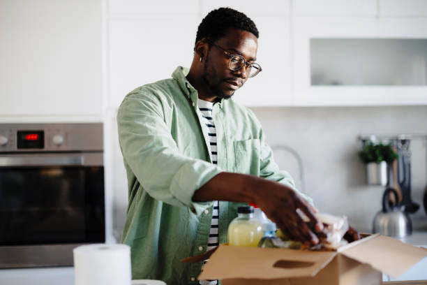 istock Man donating food for poor people 2117893686