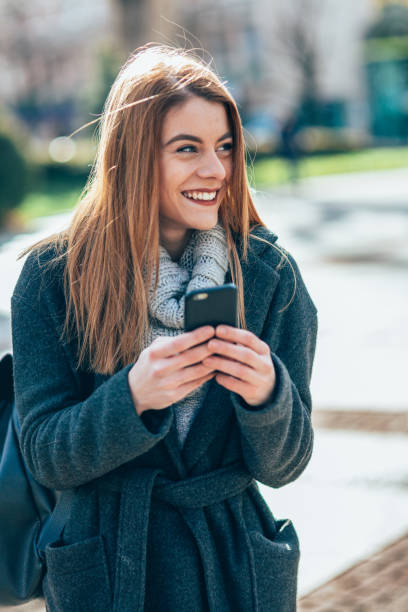 istock Texting in the city 2117909925