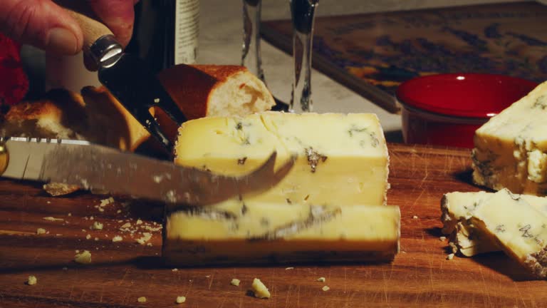 Cutting a slice of blue cheese